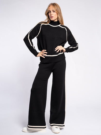 Pantalone in maglia con piping