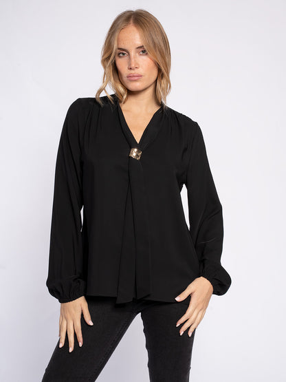 Blusa con pendaglio